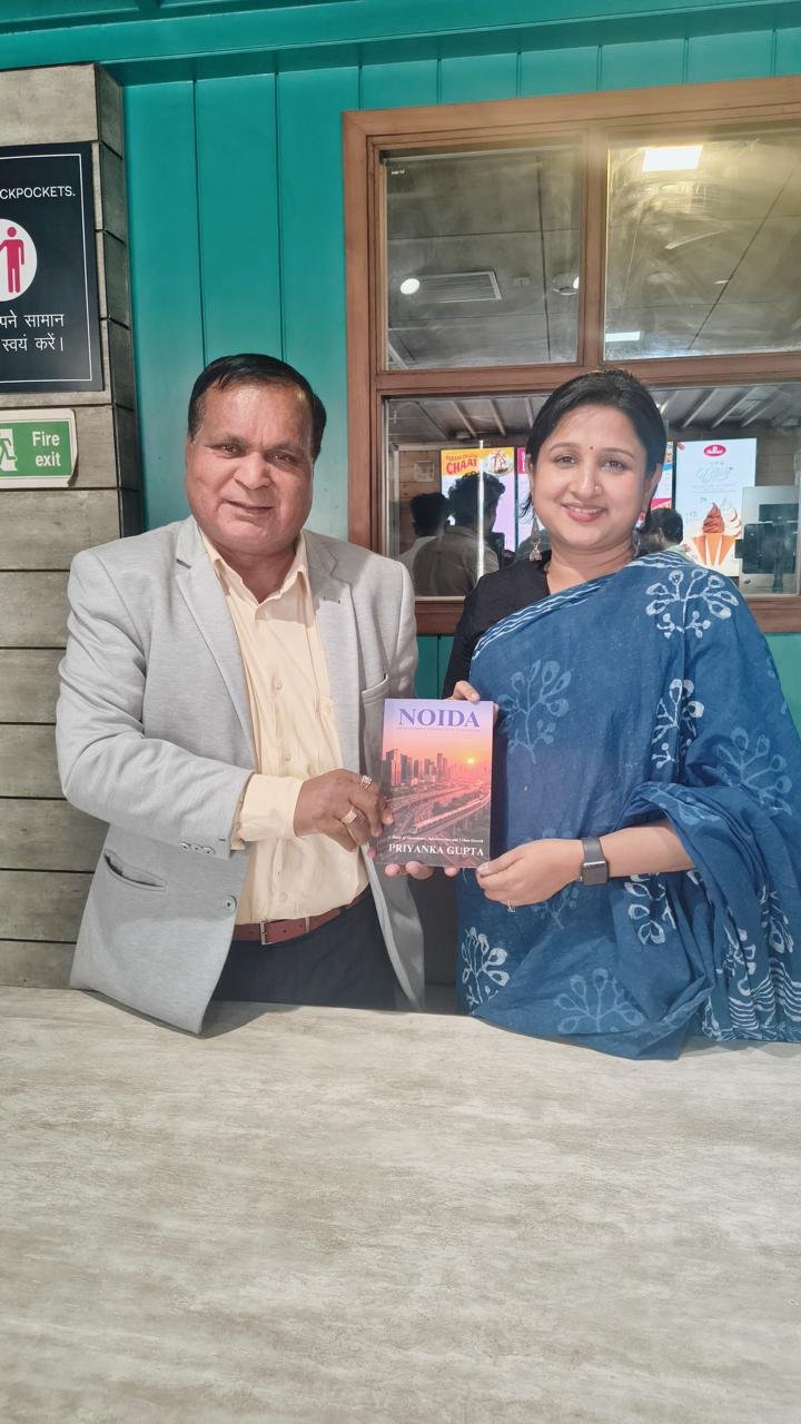 Book 'Noida' — Presented to Ten News Chairman Mr. Gajanan Mali