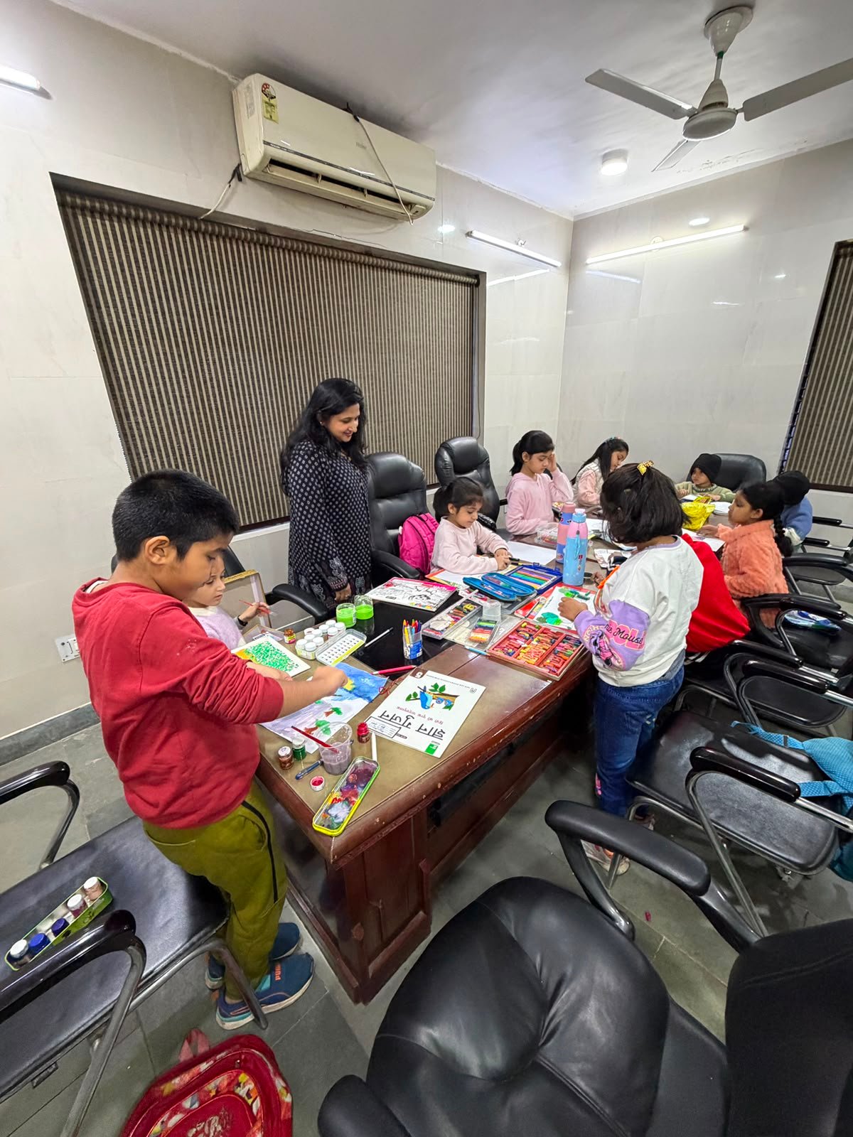 Children engaged in painting and drawing activities at the SamaajSevika Foundation girl education workshop